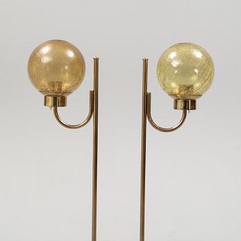 Bergboms, a pair of model 'G-118', brass and glass floor lamps. Second half of the 20th century.
