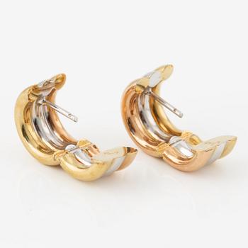 A pair of earrings in 18K gold in three colours.