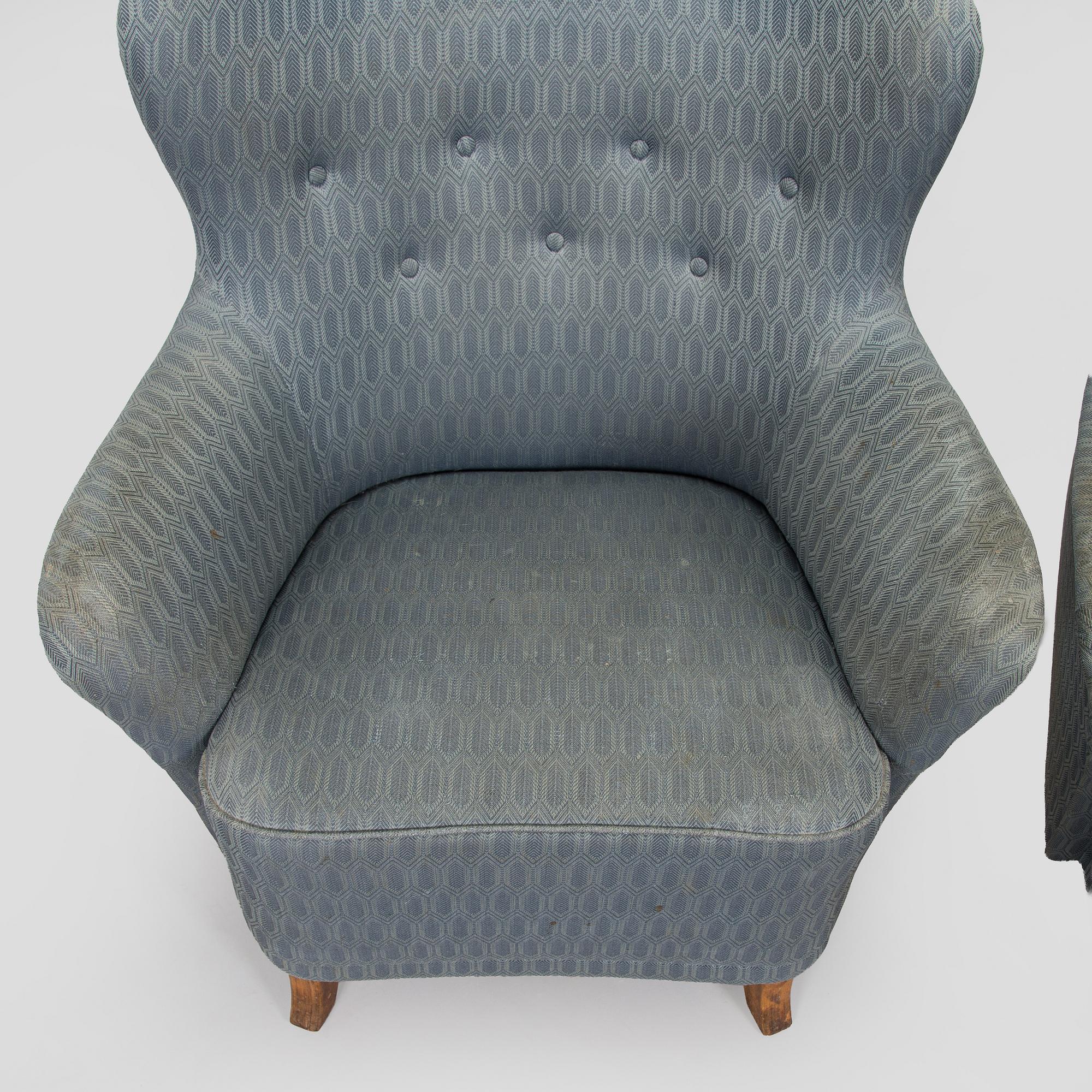 A pair of mid-20th century armchairs.