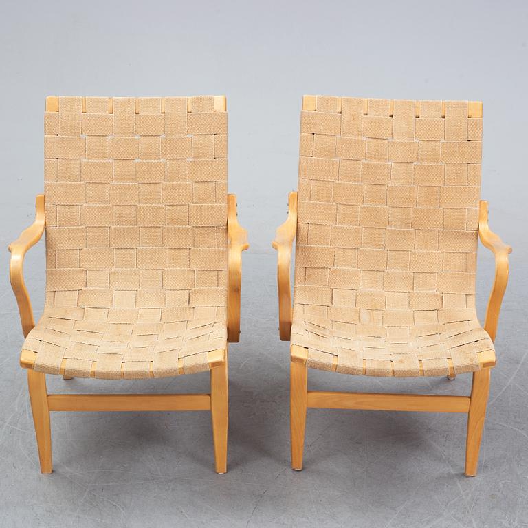 A pair of 'Eva' easy chairs by Bruno Mathsson for Firma Karl Mathsson, dated 1974.
