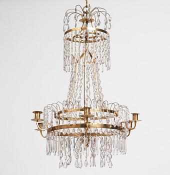 A late Gustavian gilt brass and cut glass seven-branch chandelier, Stockholm, late 18th century.
