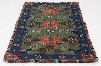 A Scania cross-stitch embroidered cushion, Sweden, around 1900, c. 99 x 47 cm.