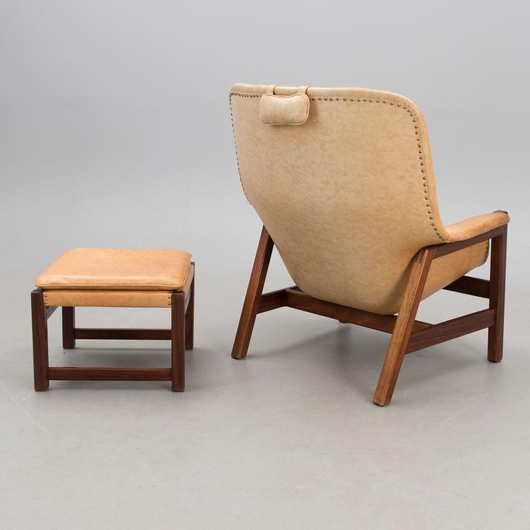 A 1960s 'Caravelle' armchair and ottoman for Puunveisto Oy - Träsnideri Ab, Finland.