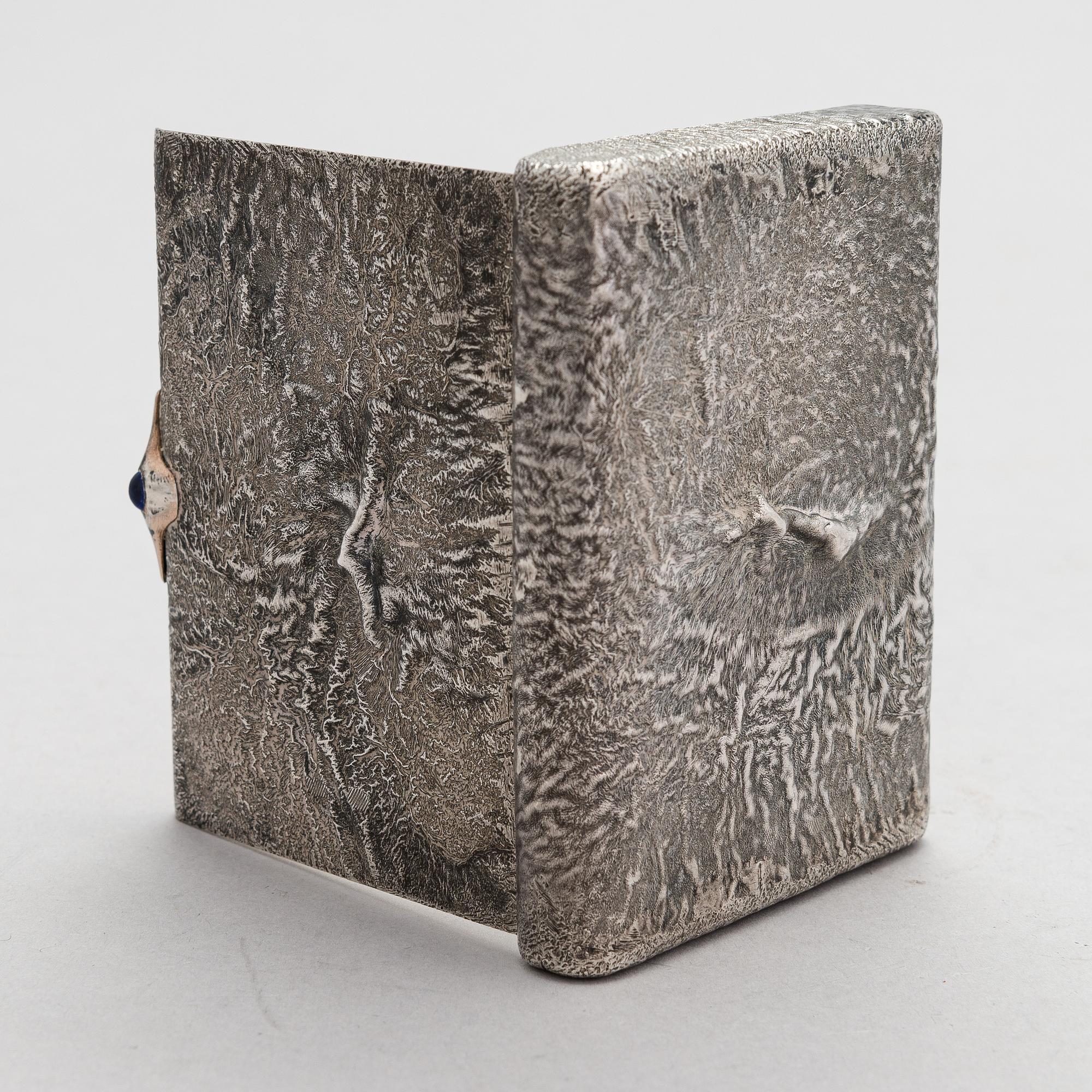 A Russian, early 20th century silver cigarette case, samorodok technique.