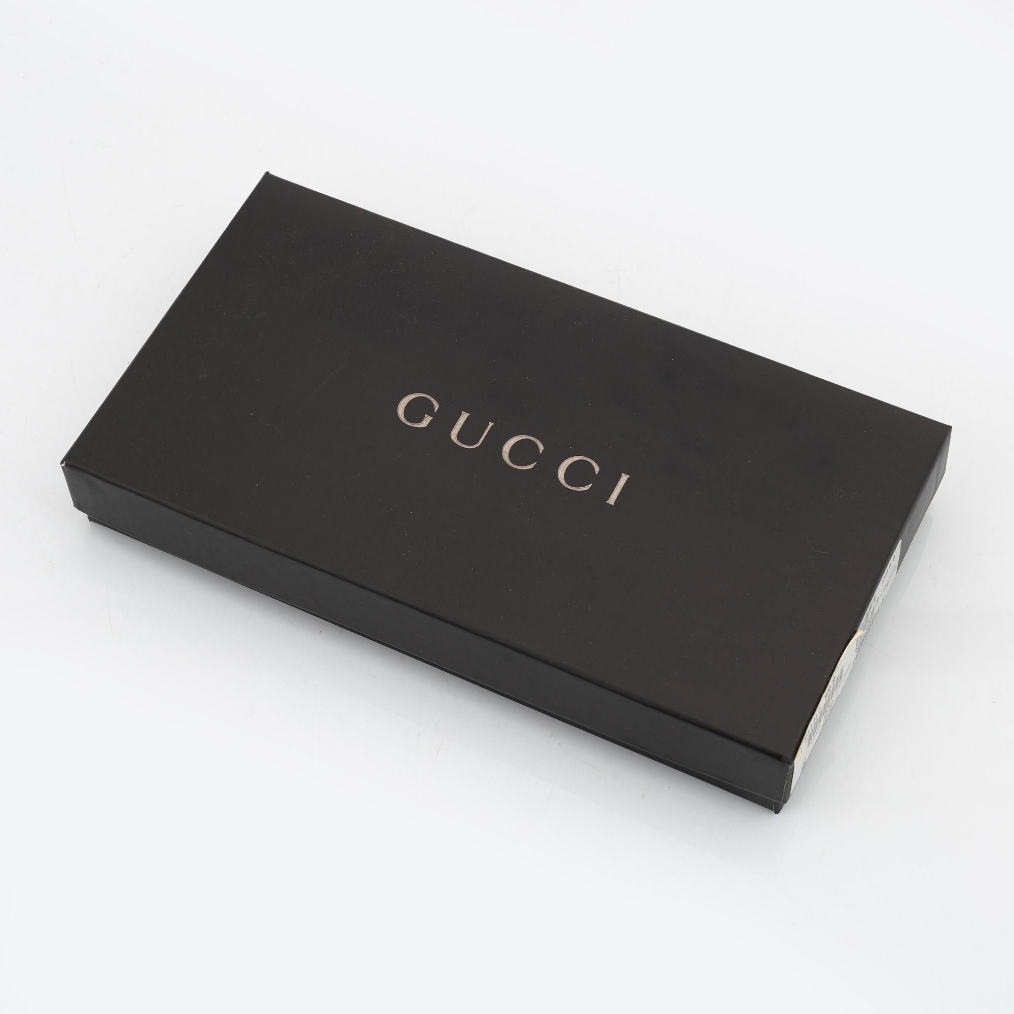 Gucci, a pair of tan leather gloves, size 6 1/2.