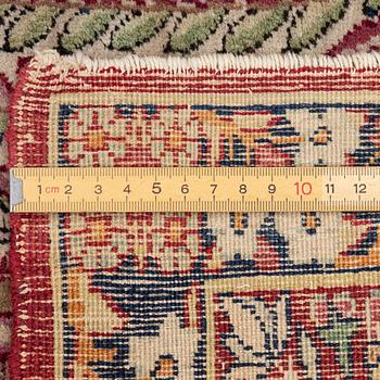 An antique Kirman rug, south Persia, c. 220 x 140 cm.