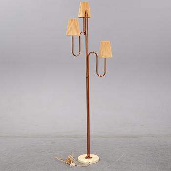 A 20th century Swedish Modern three-armed floor light.