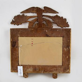 A first half of the 19th century mirror wall sconce.