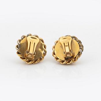 Céline, a pair of gold tone clip-on earrings.