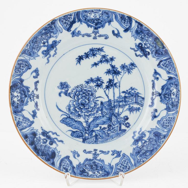 Three blue and white porcelain plates, Kangxi and Qianlong, 18th century.