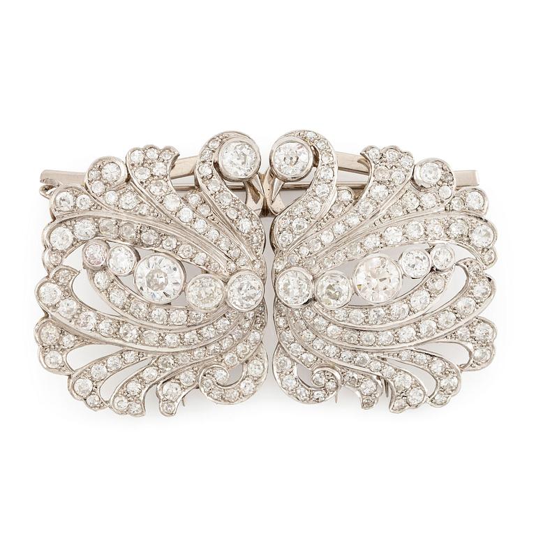 A brooch/double clip in platinum set with old- and eight cut diamonds.
