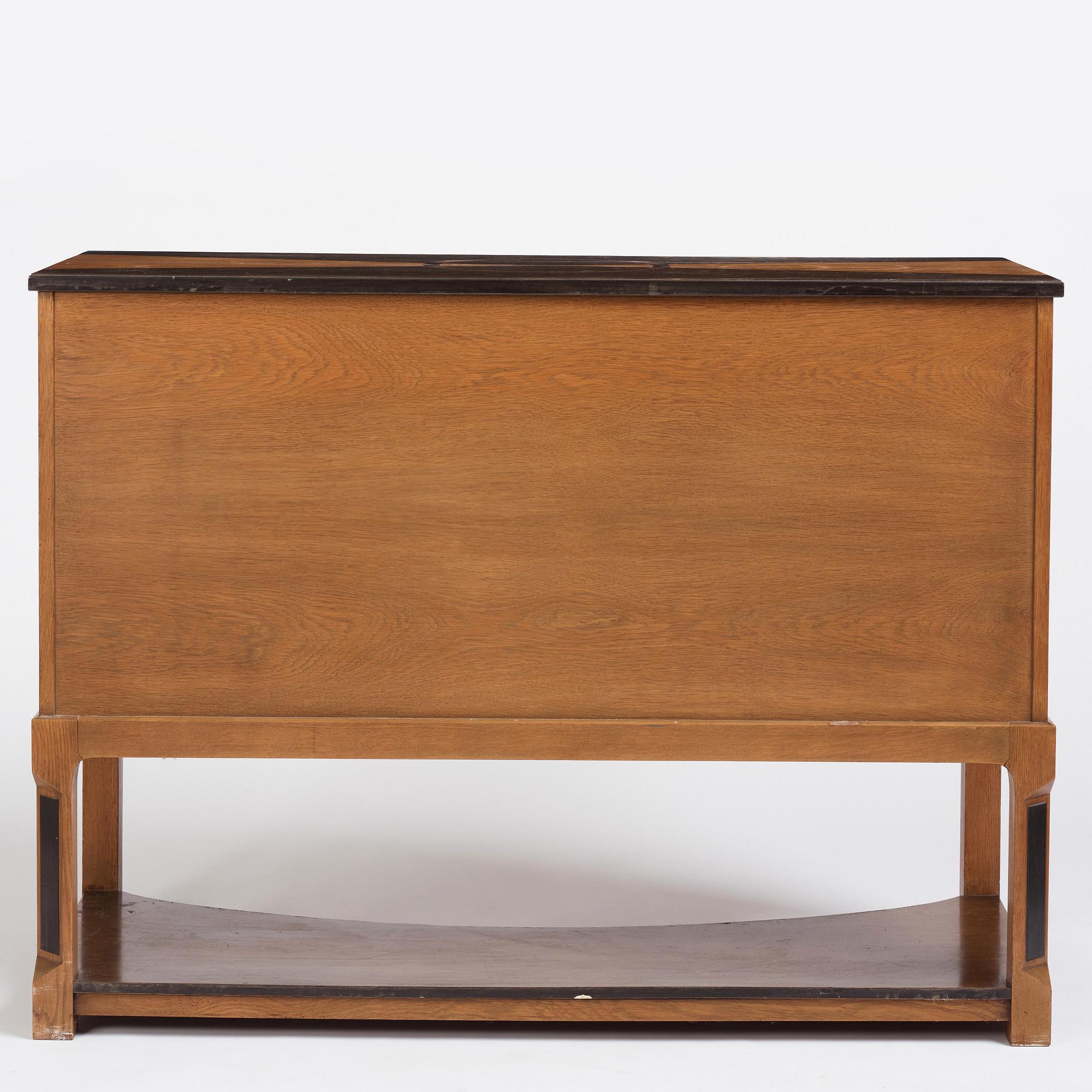 Carl Bergsten, an oak veneered sideboard/ chest of drawers, Nordiska Kompaniet Sweden 1923. Part of a set exhibited in Gothenburg 1923.