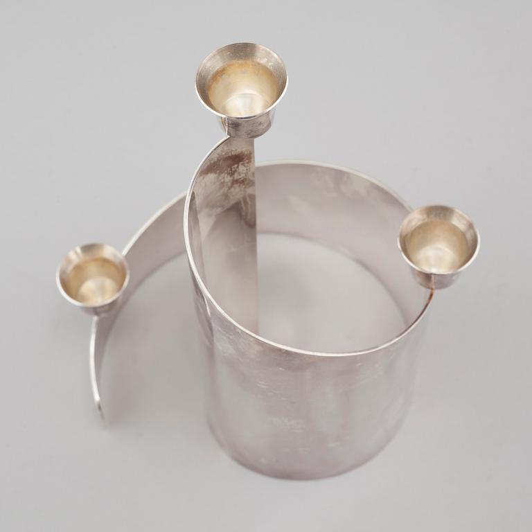 A candle holder in silver, unidentified designer, made by MEMA in linköping 1993. Weight 581 g.