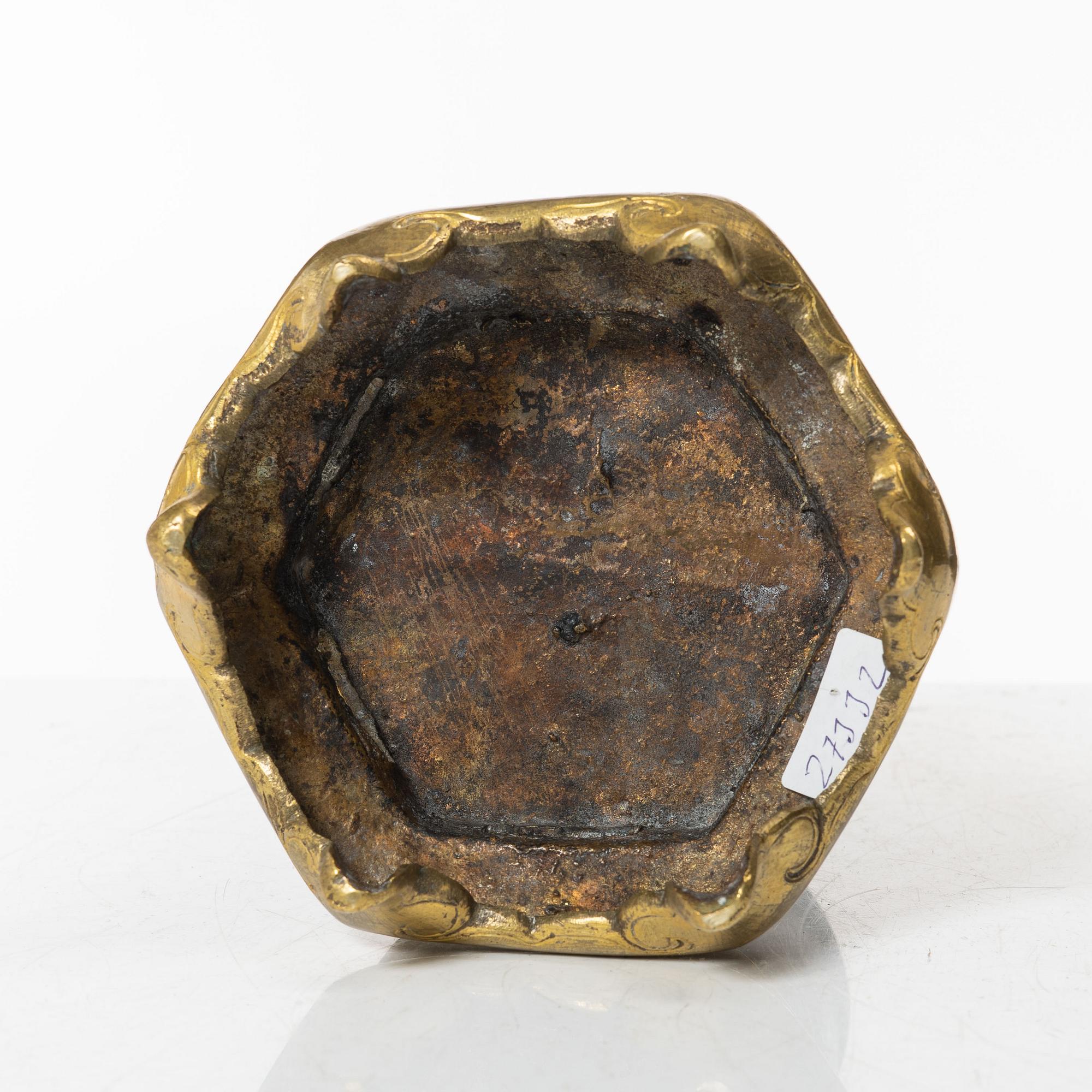 A silvered brass prayer container, Tibet, 20th century.