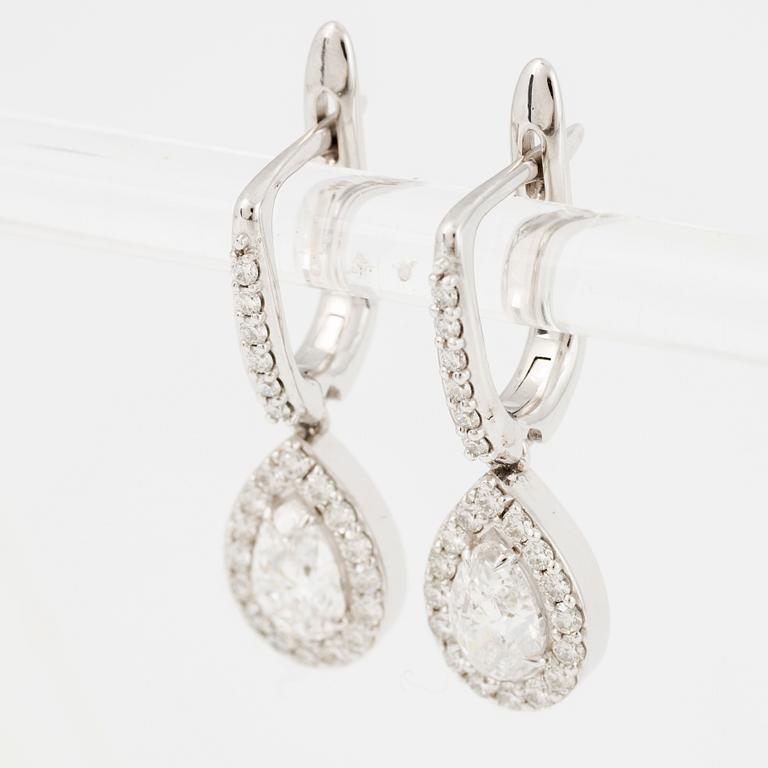 Earrings, a pair, 18K white gold set with pear-shaped and brilliant-cut diamonds.