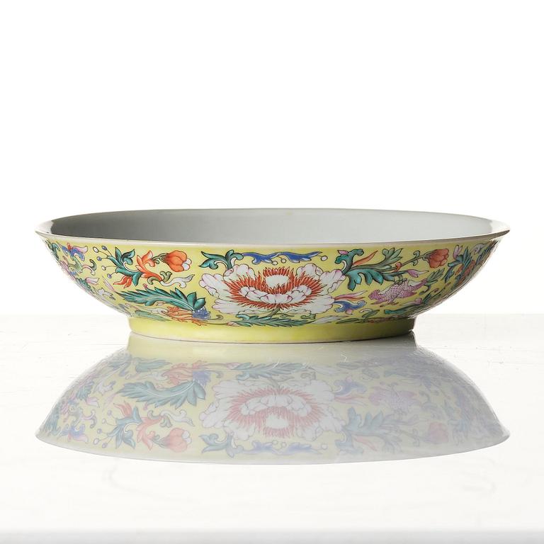 A yellow ground famille-rose 'floral' dish, Qing dynasty, Daoguang seal mark and period of (1821-50).