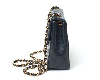 A 1970s black quilt leather shoulder bag by Chanel.