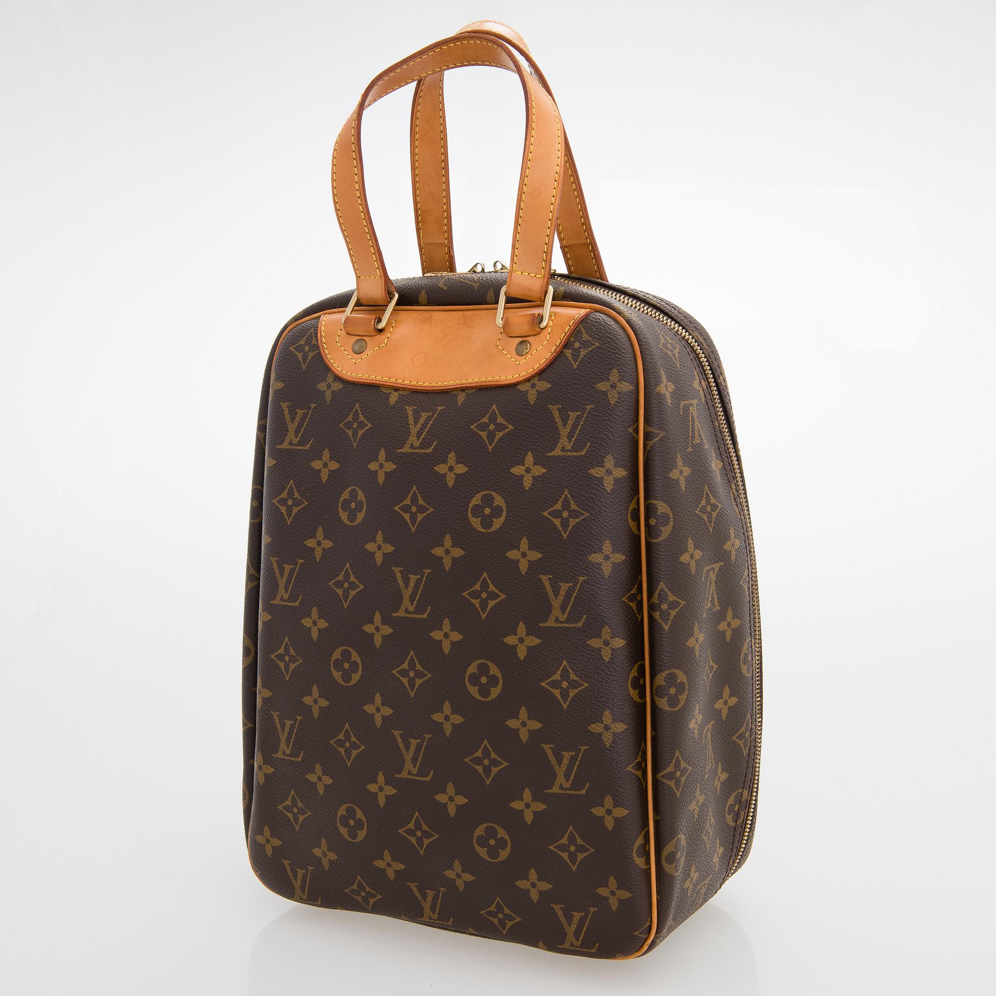LOUIS VUITTON Monogram Canvas Excursion Bag.