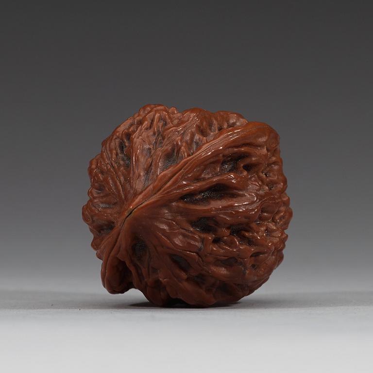 Two pairs of carved walnut hand exercisers, late Qing dynasty (1644-1912).