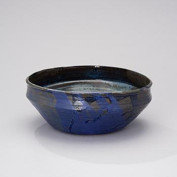 A ceramic bowl signed AMO.