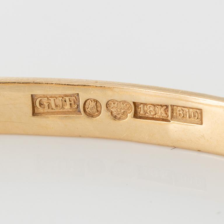 Bracelet 18K gold with green stone.