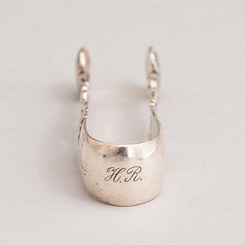 A silver sugar tong and a 3-piece silver coffee set, mark of Juho H. Pekuri, Oulu 1931 and Finnish import marks 1938.