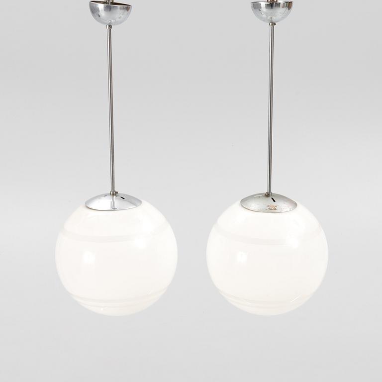 Harald Notini, a pair of ceiling lamps, a version of model "10148", Arvid Böhlmarks Lampfabrik, 1930's.