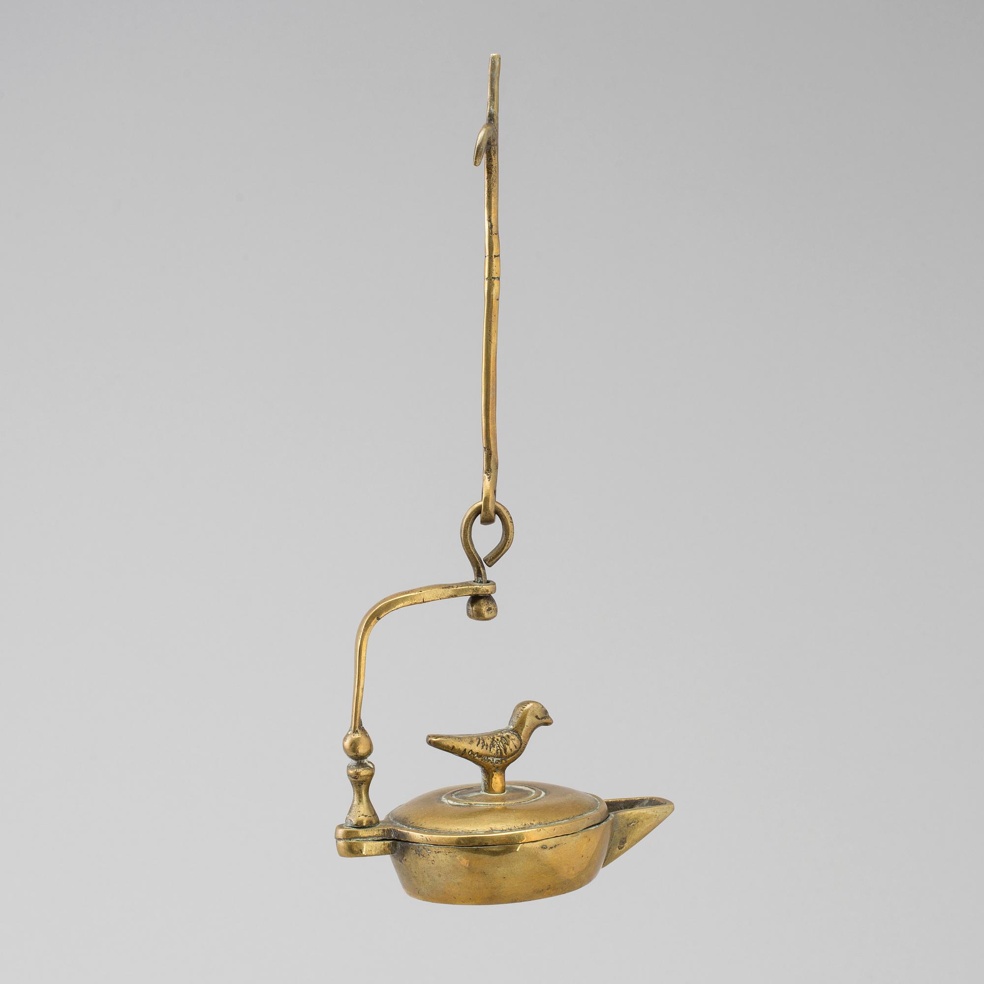 An 18th century bronze oil lamp.