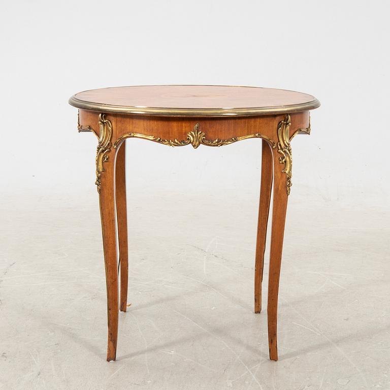 A walnut and mahogany Louis XV-style table first half of the 20th century.