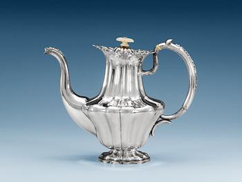 1276. A RUSSIAN PARCEL-GILT COFFEE-POT, makers mark of Adolf Sper, St. Petersburg 1842.