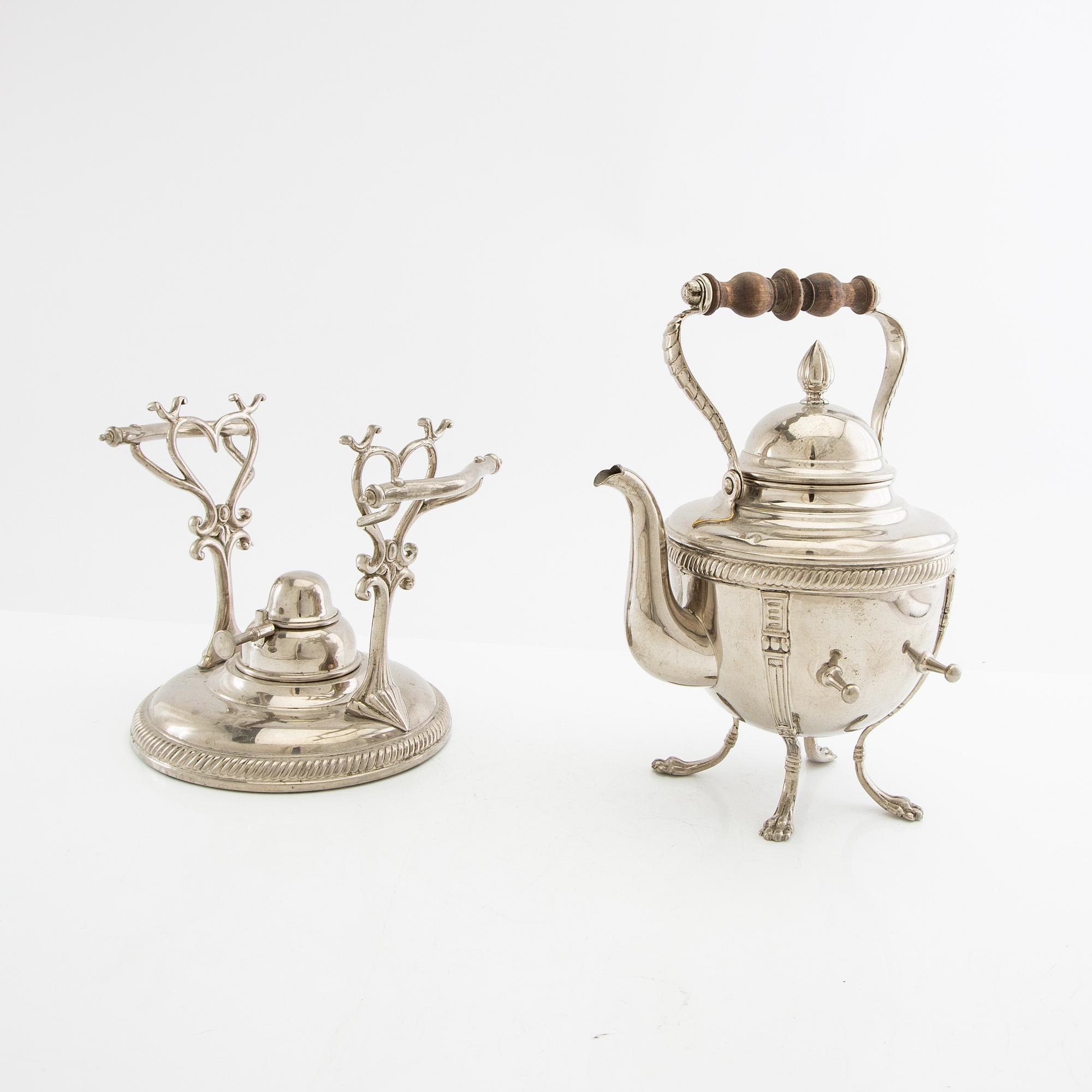 Tea kettle with a burner around 1900.