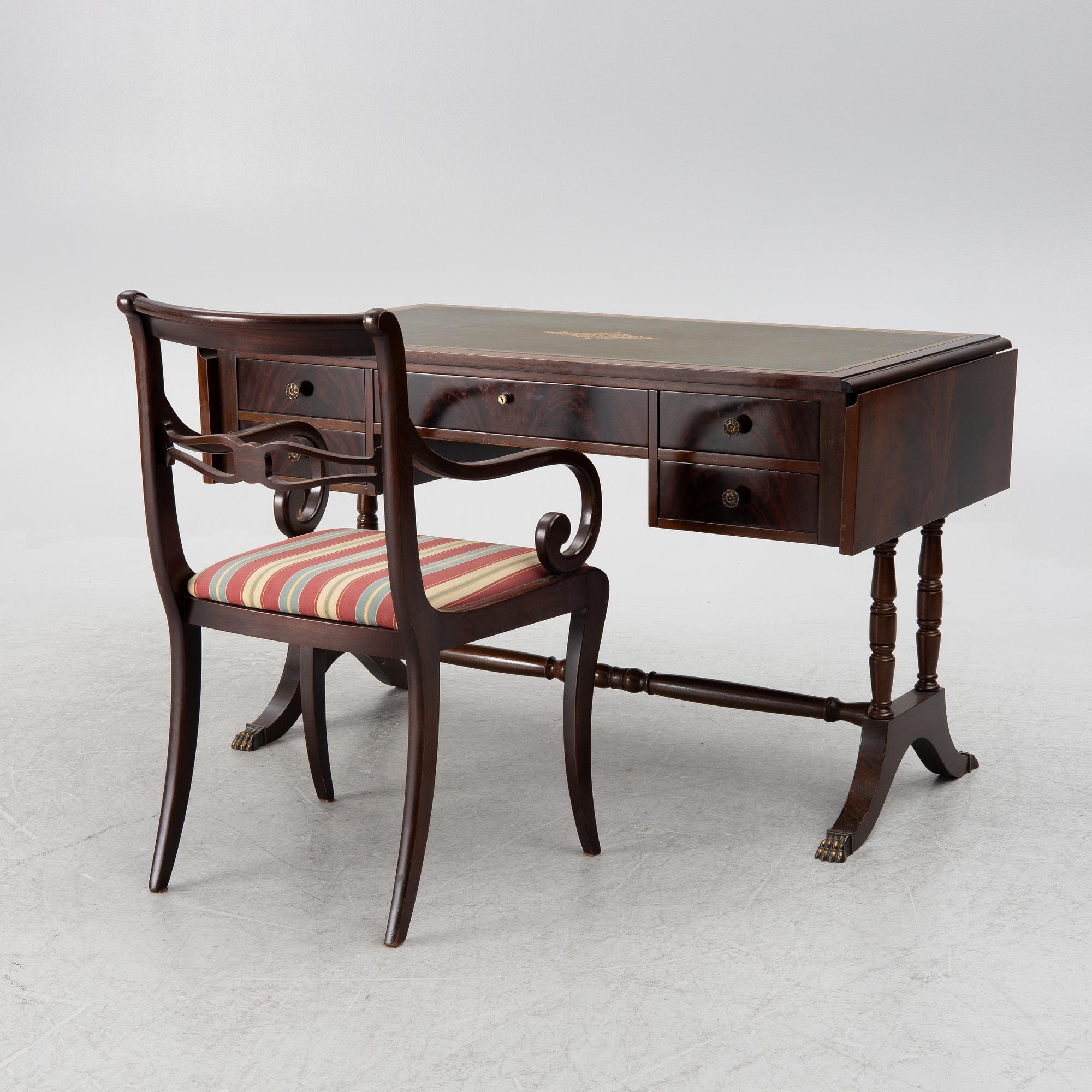 A mahogany veneer desk with desk chair, 20th Century.