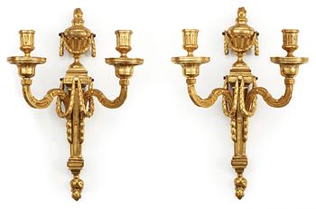 642. A pair of Louis XVI late 18th century gilt bronze two-light wall-lights.