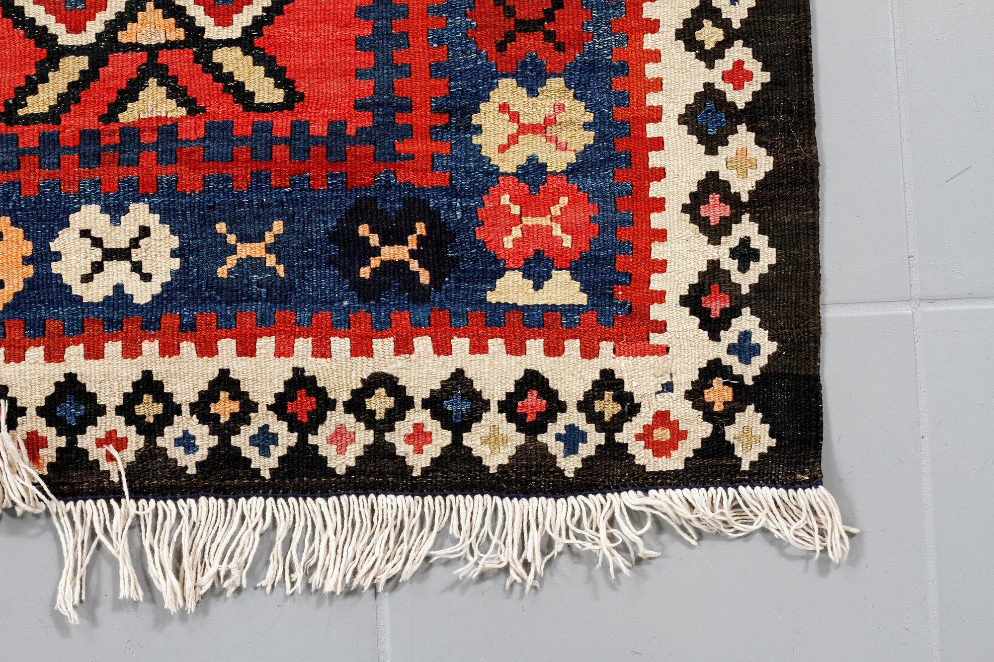 A kelim rug, 342 x 150 cm.