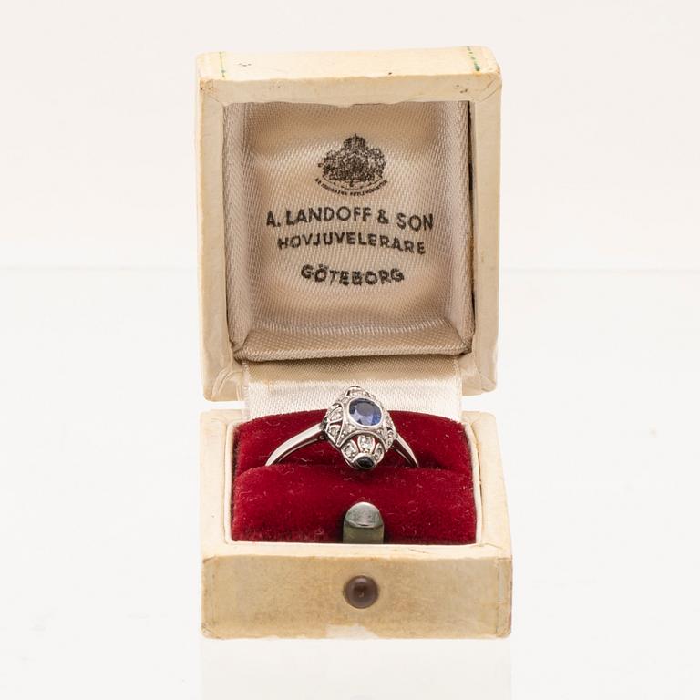 Art Deco platinum ring with an oval faceted sapphire and old-cut and rose-cut diamonds.