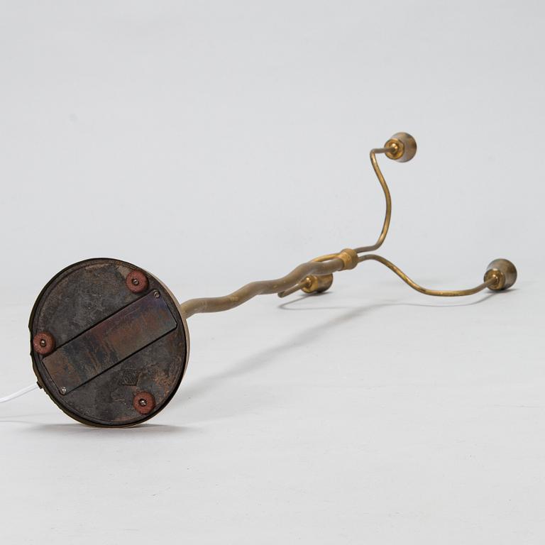 A mid-20th-century three-arm floor light.