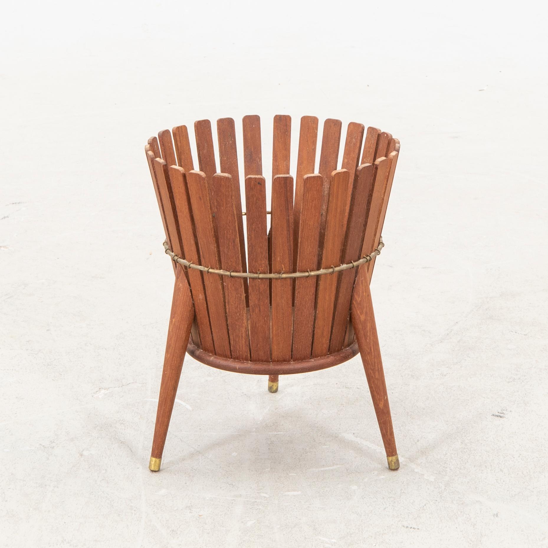 A 1950s teak wastepaper basket.