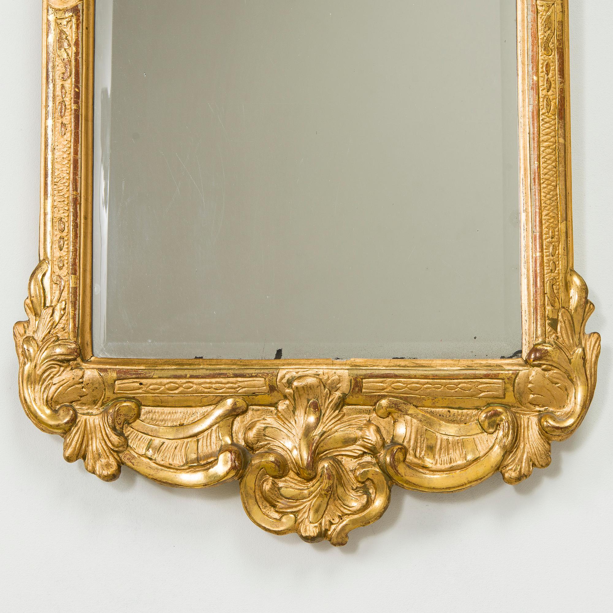 A Rococo giltwood mirror by Nils Meunier (master in Stockholm 1754-97, royal court mirror maker 1769).