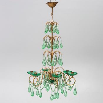 A chandelier, likely from Italy, circa 1950.
