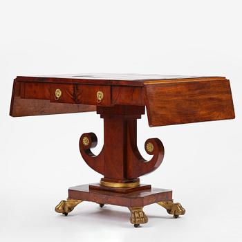 A Swedish Empire mahogany center table.