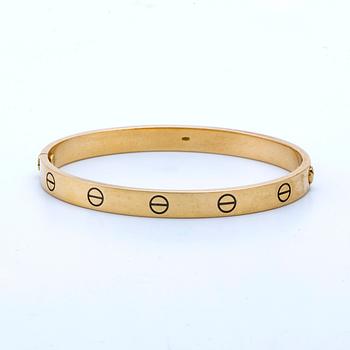 Cartier "Love" armband 18K guld, storlek 18, inköpt år 2000 i Hongkong.