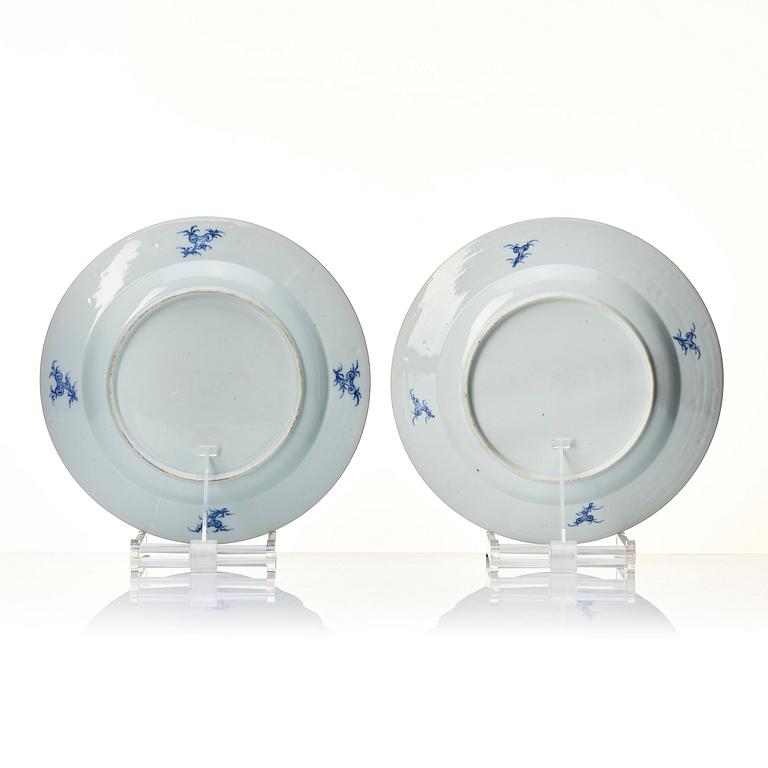 A pair of blue and white soft paste armorial dishes, Qing dynasty, Qianlong (1736-95).