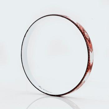 A bangle by Michaela Frey with multi-coloured enamel decoration.