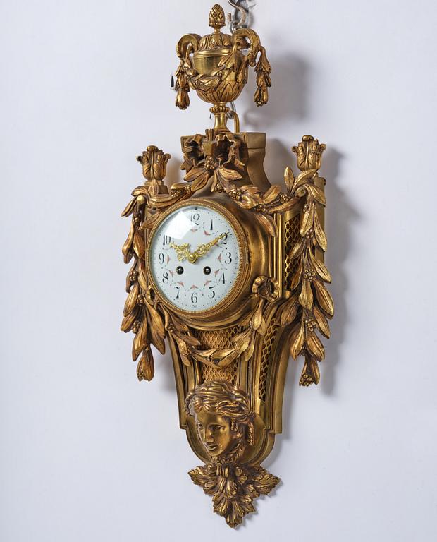 A French  Louis XVI-style wall clock, around 1900.