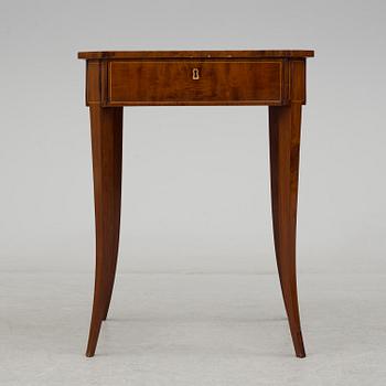 A second half of the 19th century mahogany veneered table.