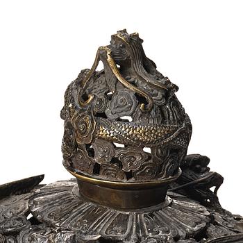 A bronze reticulated incense burner with cover, Qing dynasty (1644-1912).