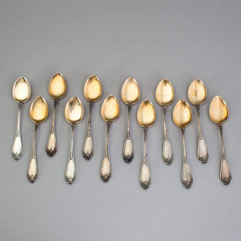 A set of 12 Fabergé parcel-gilt caviar-spoons, Moscow 1899-1908.