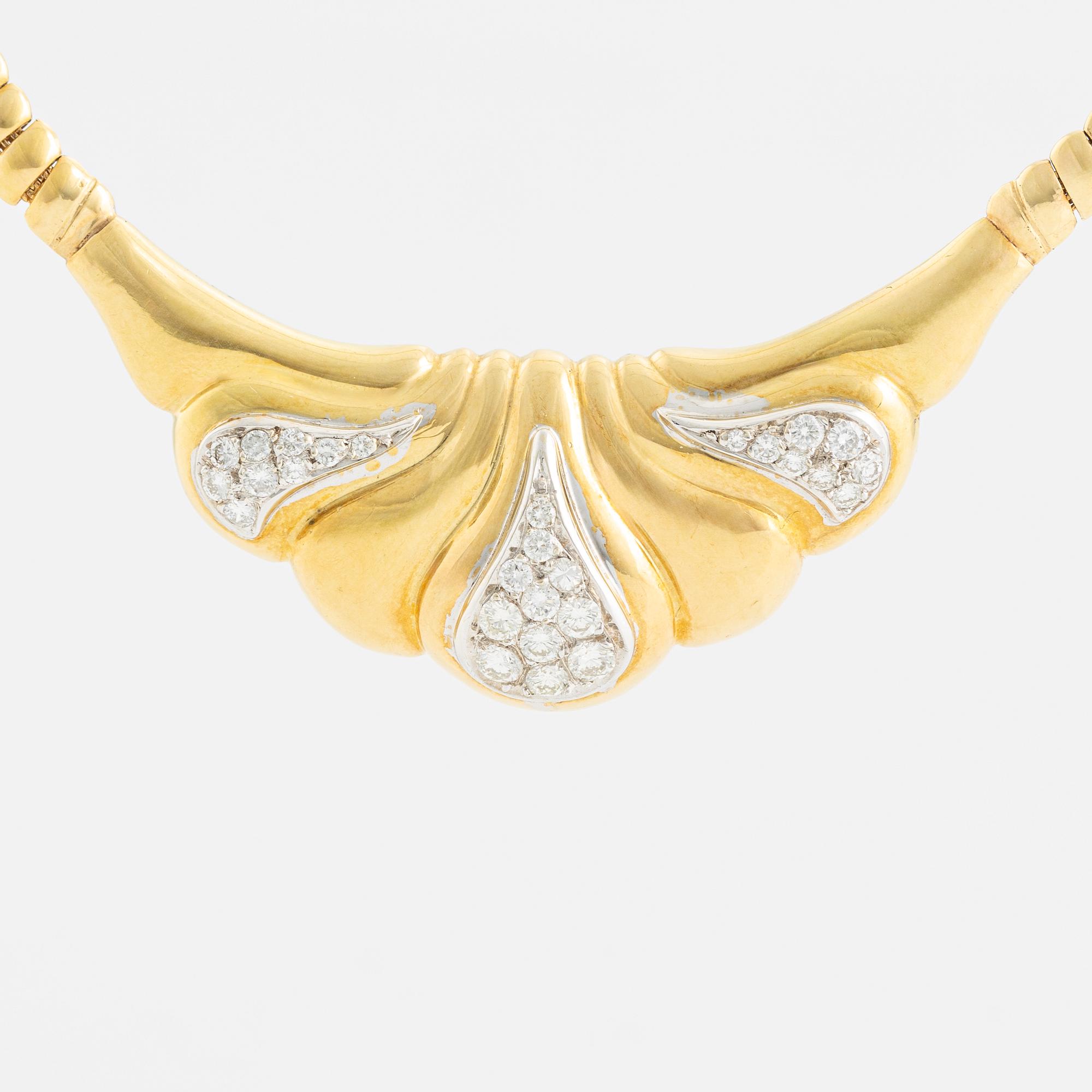 An 18K gold necklace set with round brilliant-cut diamonds.