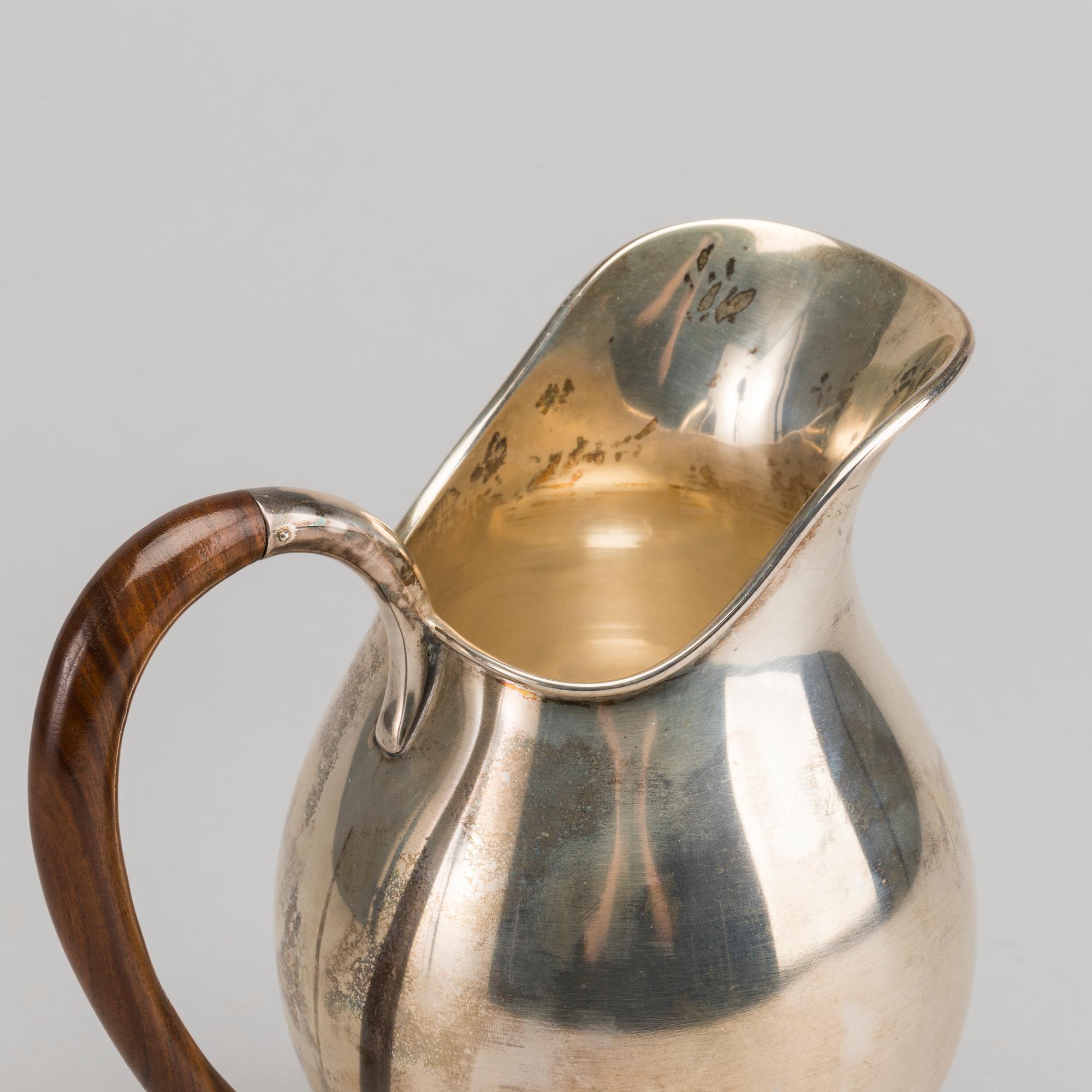 A Swedish 20th century sterling jug mark of Nordisk silverkonst Helsingborg 1948, total weight 347 gr.