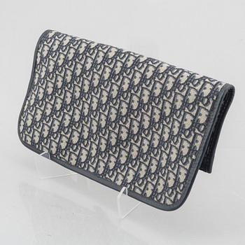 Christian Dior, bag/clutch, "Oblique fold-over convertible clutch".